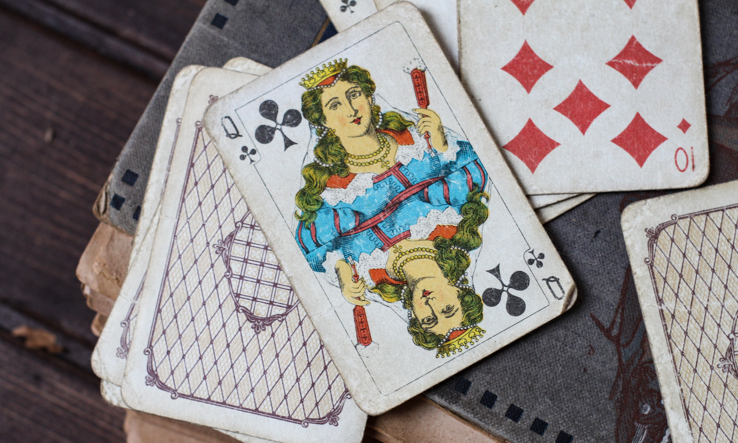 old playing cards on a notebook