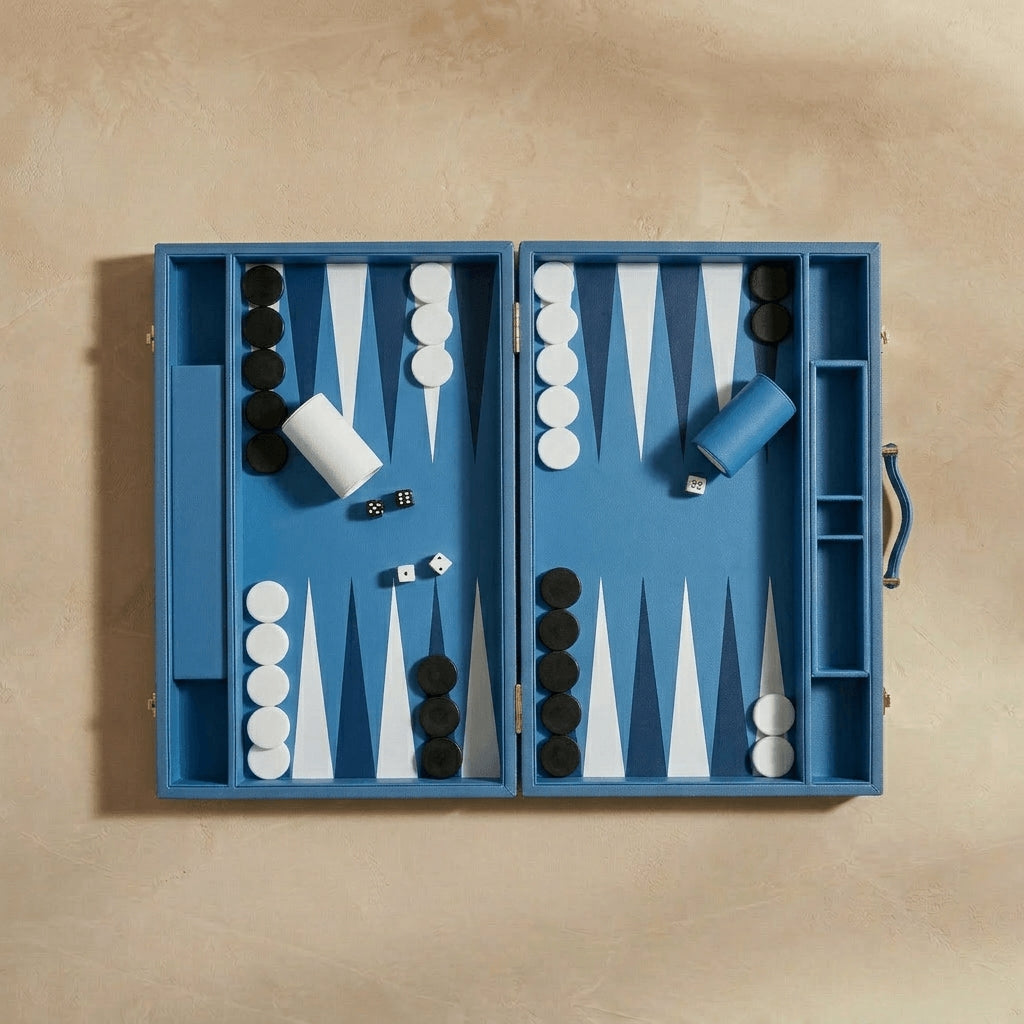 Blue backgammon set with pieces on a beige background