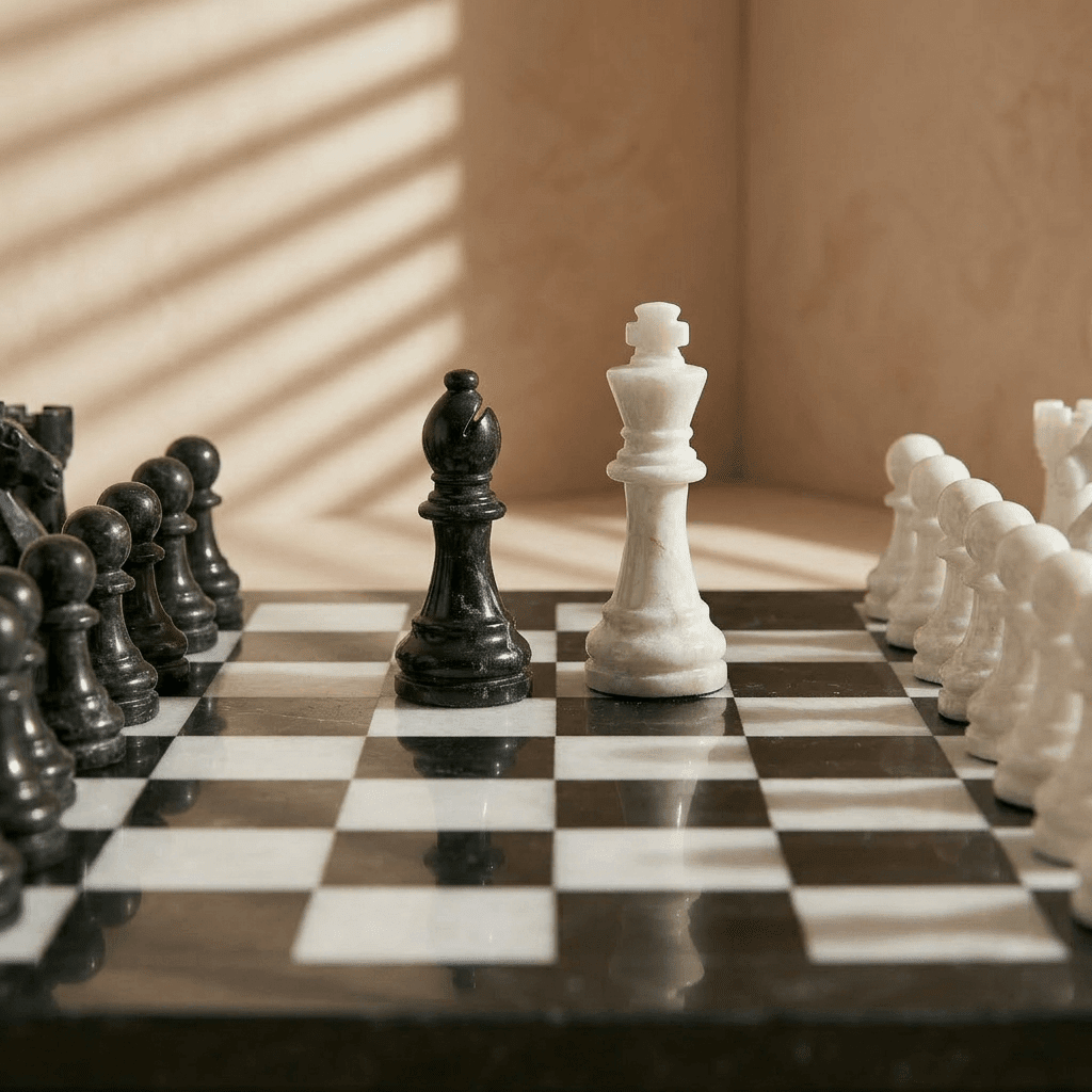 Chessboard with black and white pieces on a wooden surface