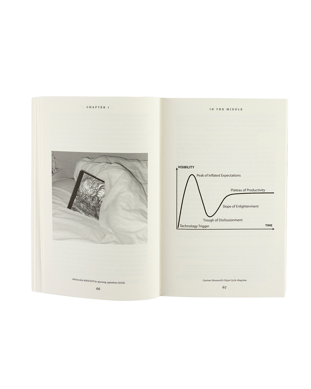 Open book with text and a graph on a white background