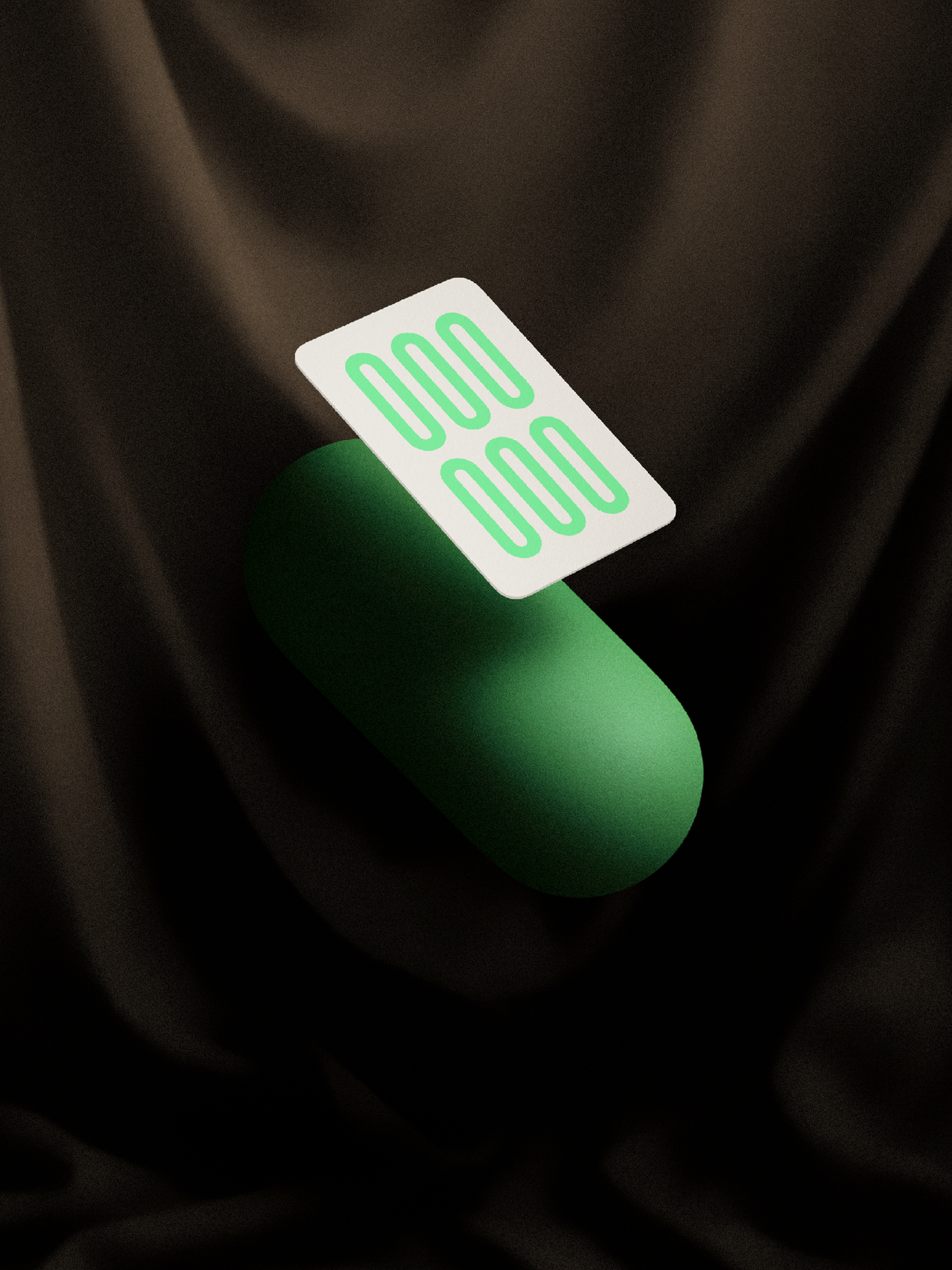 Green cylindrical object with a white card featuring green lines on a dark fabric background