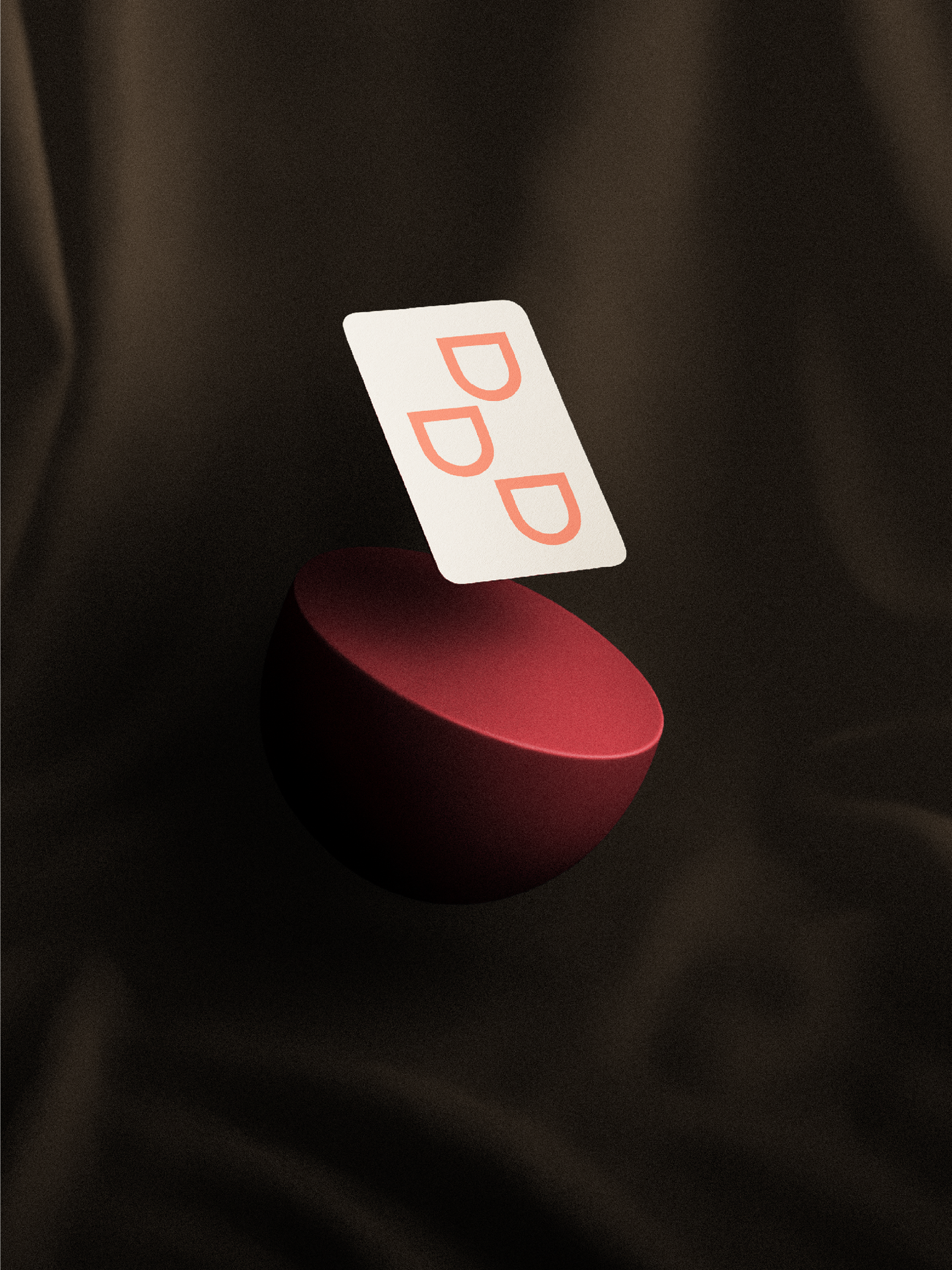 Card with 'DD' logo on a red stand against a dark background