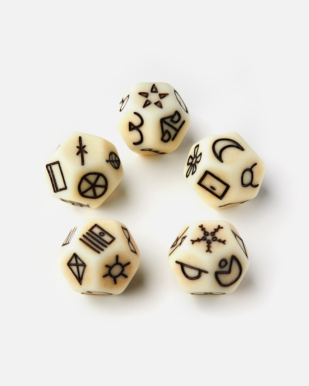 Set of six dice with star, moon, and sun symbols on a white background