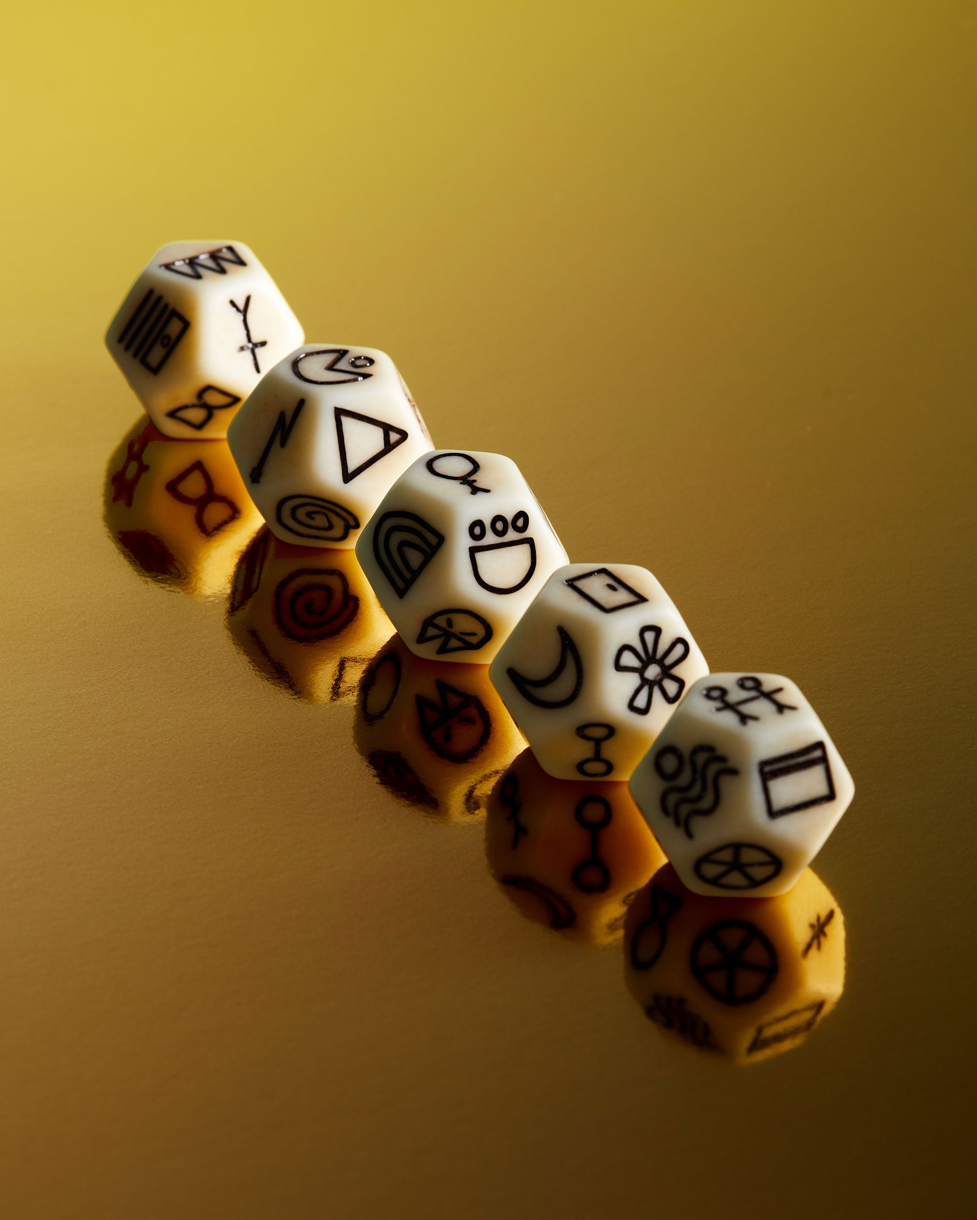 Set of dice with symbols on a gold background