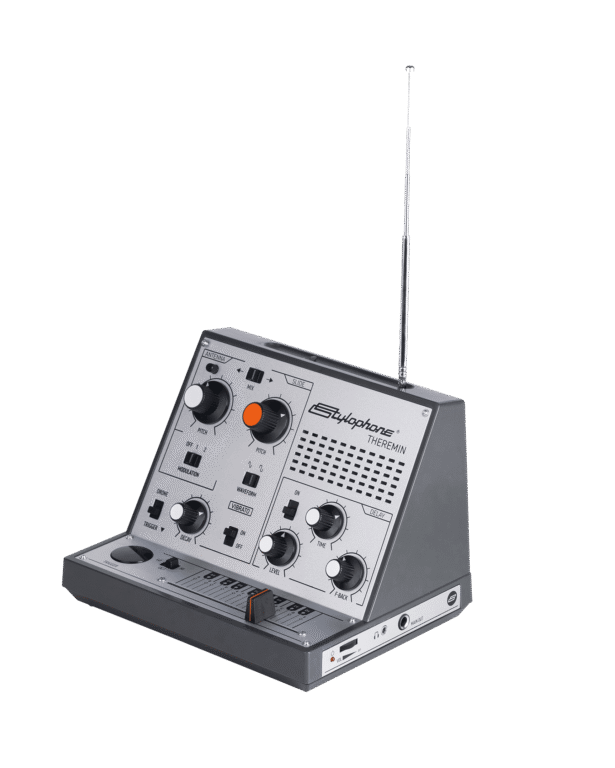 Vintage electronic device with control panel and antenna on a gray background