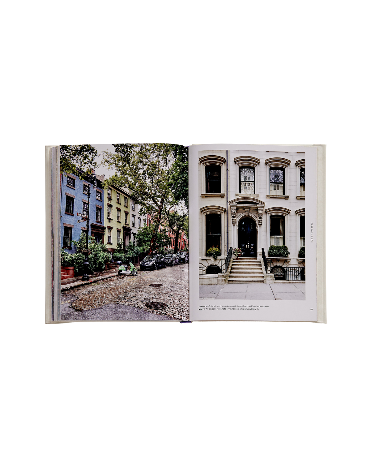 An open book showing two architectural street scenes on the left and right pages, photographed against a plain white background.