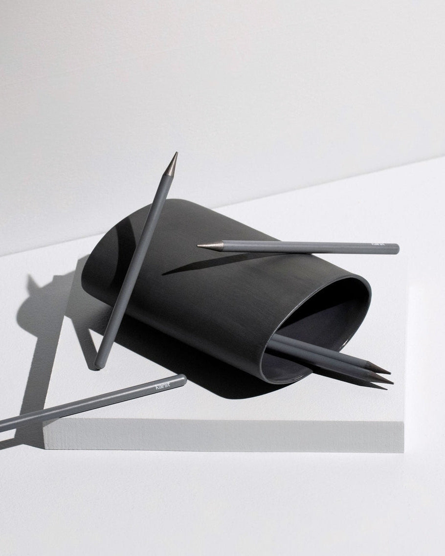 Black paper sculpture with sharp edges on a white background