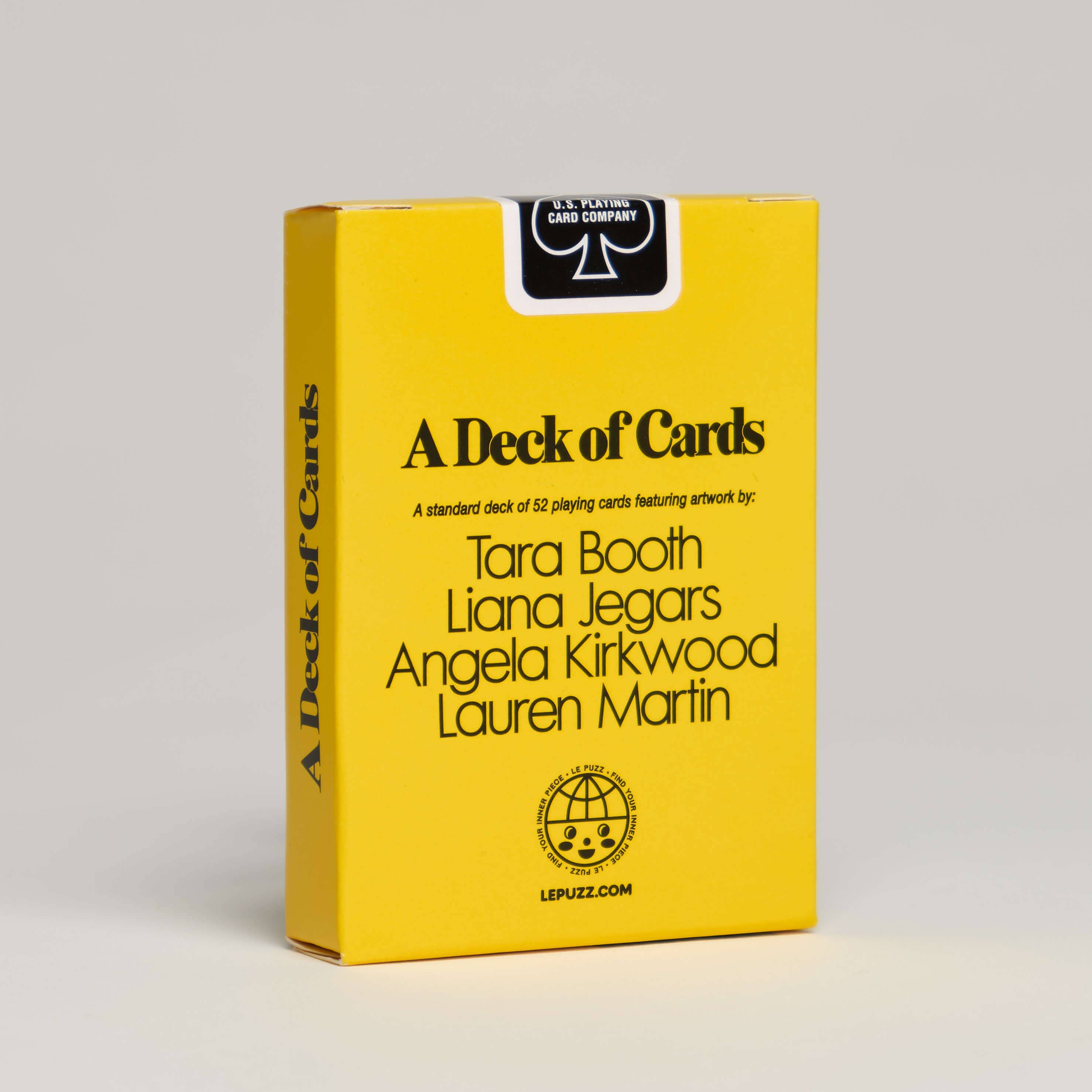 Yellow box of playing cards with black text on a gray background