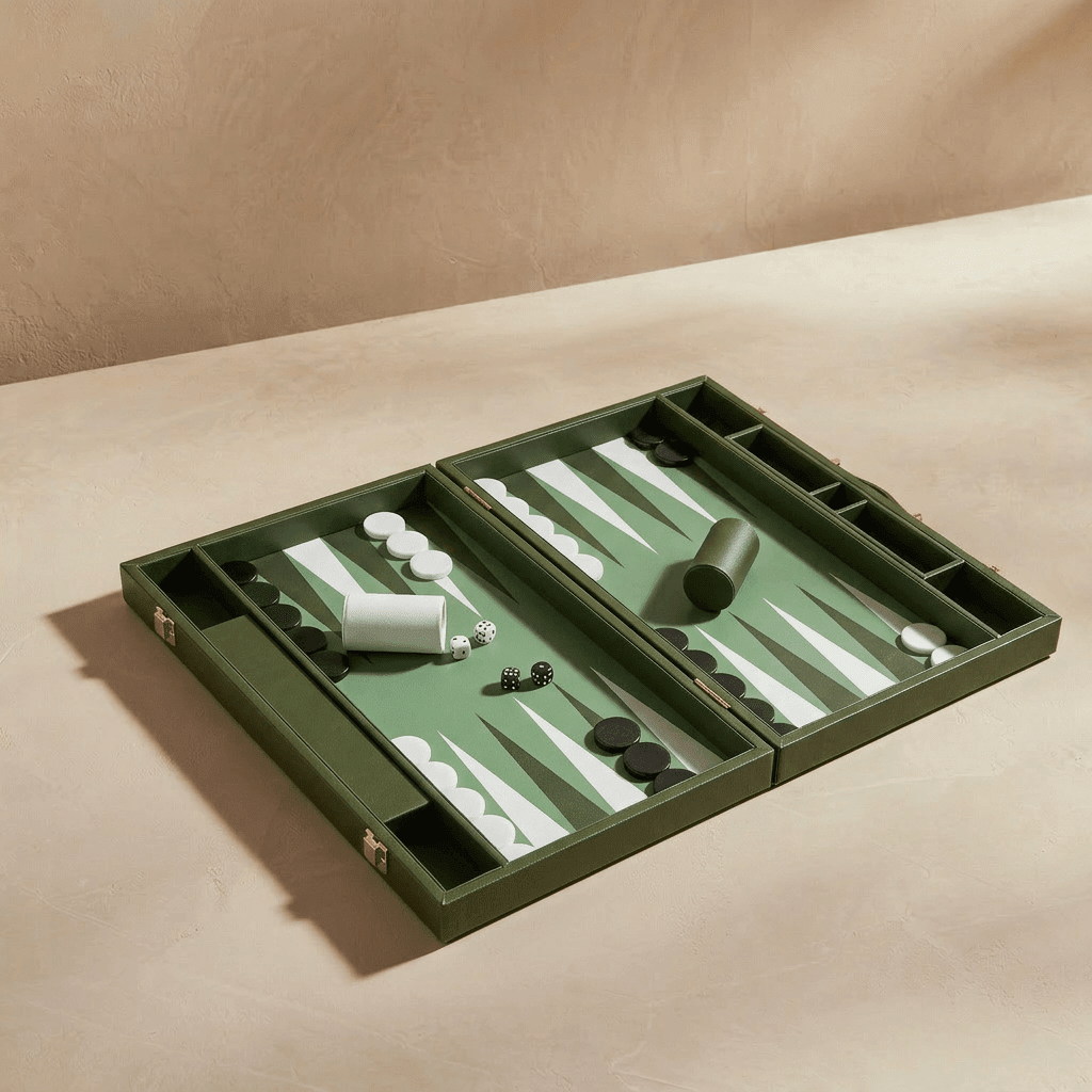 Green backgammon set on a beige surface