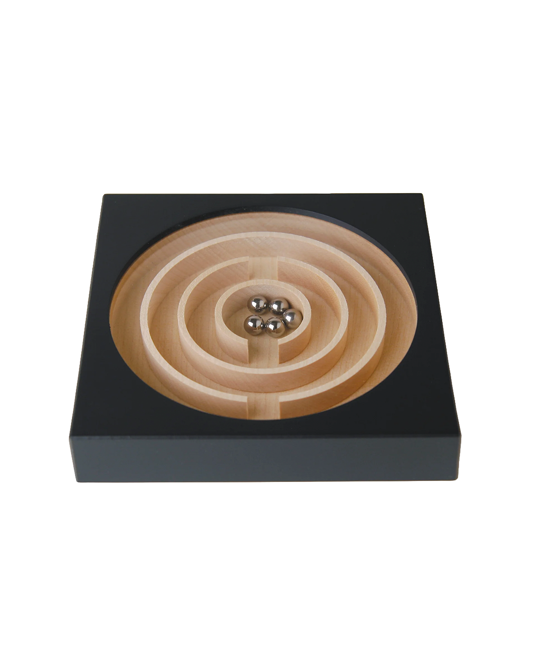 A wooden magnetic marble run toy with concentric spiral tracks carved into a square black base, shown on a plain white background.