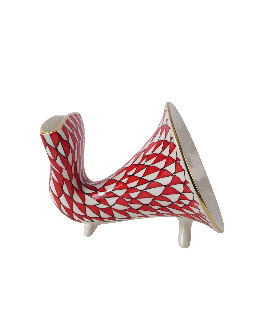 A sculptural ceramic phone stand with a red and white geometric pattern