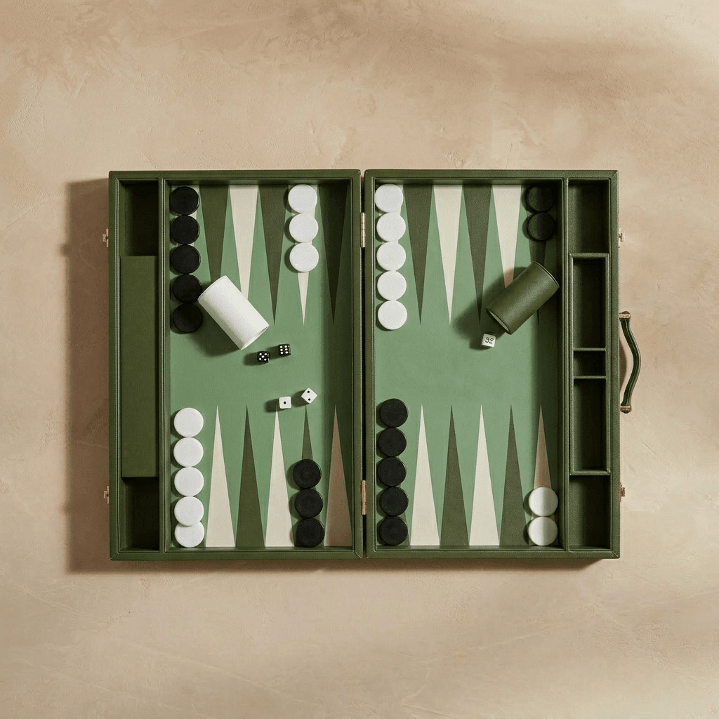 Backgammon set with pieces and dice on a beige background