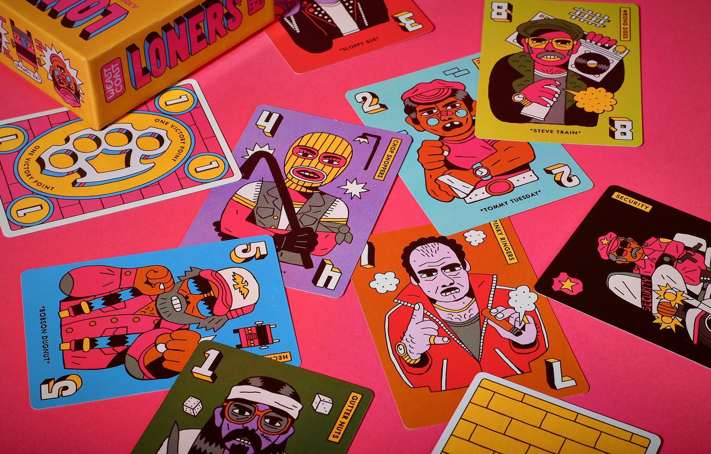 Colorful card game with character illustrations on a pink background