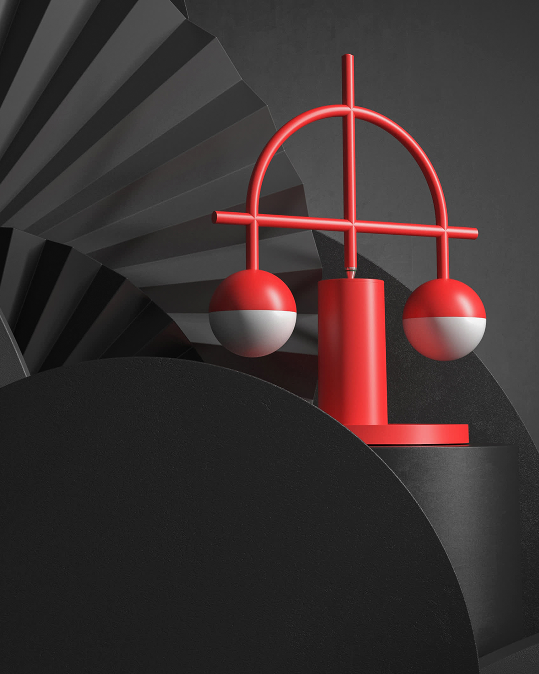 A red and white geometric decorative object resembling a stylized balance scale with two spherical weights, shown on a dark gray abstract studio background.