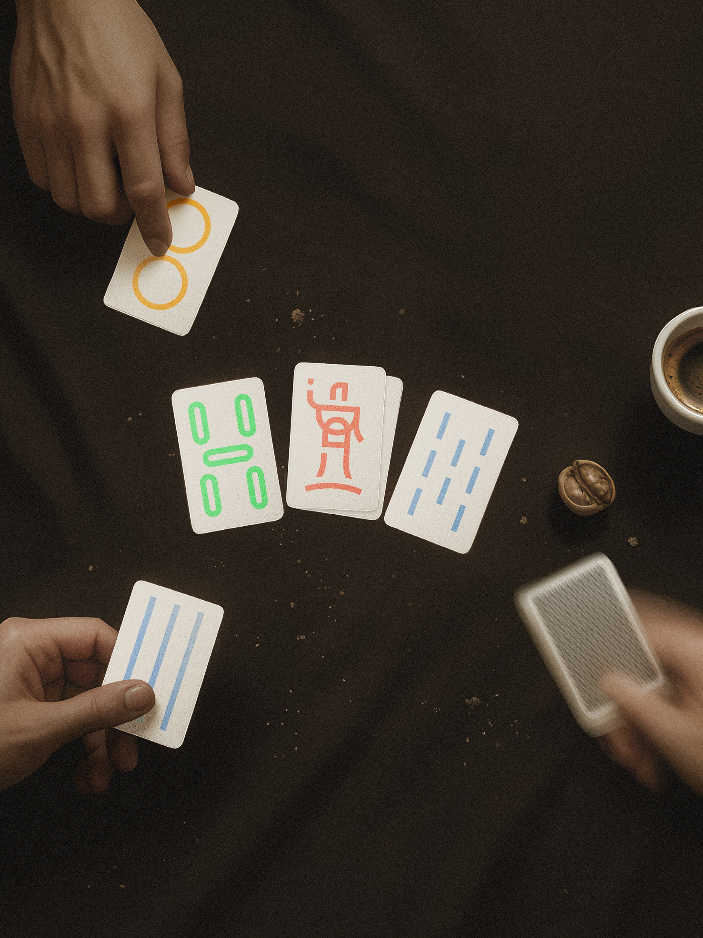 Card game with symbols on a dark surface