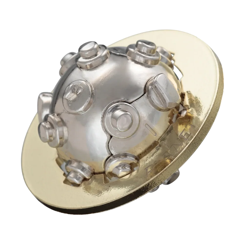 A flat gold metal ring surrounds a silver metal sphere with various nubs in this small pocket puzzle.