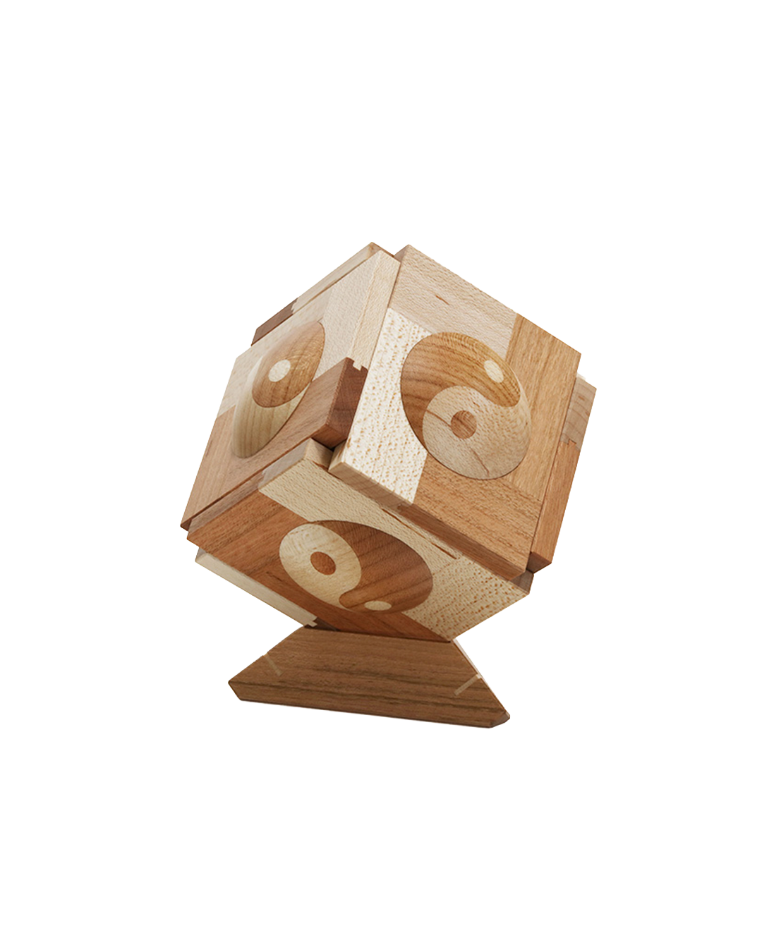a cube-shapped puzzle box with the yin-yng symbol on each face.