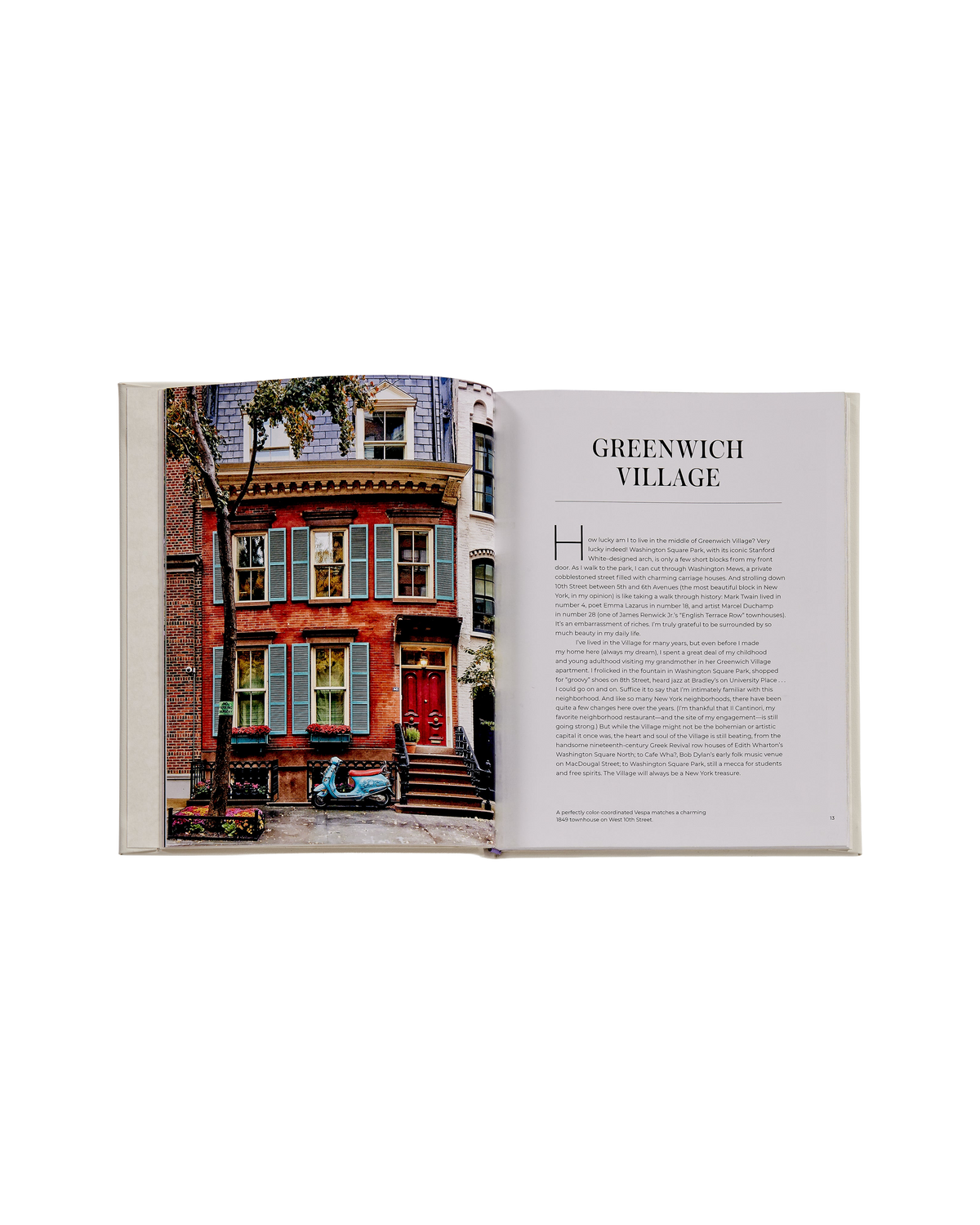 An open book showing a color photograph of a red brick house in Greenwich Village with a light blue scooter parked in front, alongside a text page titled 'GREENWICH VILLAGE'.