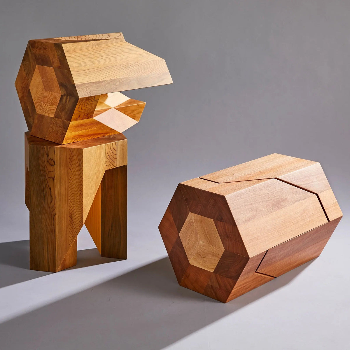 Geometric wooden stools on a gray background